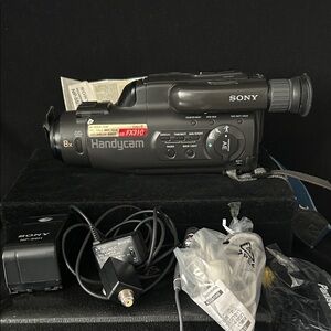 Sony Handycam FX310 in Black with Accessories Works Well Needs The Battery Charg